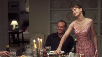 Movie still from “Something's Gotta Give” (2003), directed by Nancy Meyers – A man and a woman at a dinner table; Medium shot, Over the shoulder angle