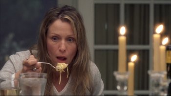 Movie still from “Something's Gotta Give” (2003), directed by Nancy Meyers – A woman is eating noodles with a fork; Close Up shot, Over the shoulder angle