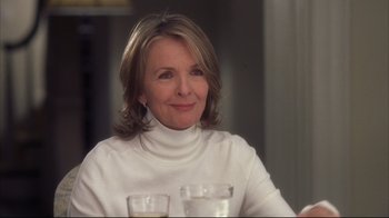 Movie still from “Something's Gotta Give” (2003), directed by Nancy Meyers – A person sitting at a table; Close Up shot, Over the shoulder angle