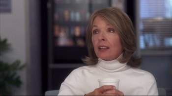 Movie still from “Something's Gotta Give” (2003), directed by Nancy Meyers – A person holding a cup of coffee; Close Up shot, Over the shoulder angle