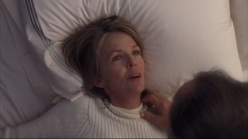 Movie still from “Something's Gotta Give” (2003), directed by Nancy Meyers – A woman laying in a bed with her head on a pillow; Close Up shot, Over the shoulder angle