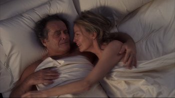 Movie still from “Something's Gotta Give” (2003), directed by Nancy Meyers – A man and a woman laying in a bed together; Medium shot, Overhead angle