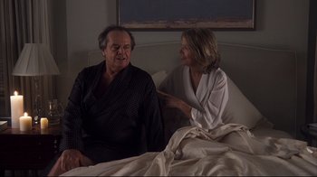 Movie still from “Something's Gotta Give” (2003), directed by Nancy Meyers – An older man and a younger woman sitting on a bed; Medium shot, Over the shoulder angle