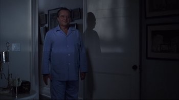 Movie still from “Something's Gotta Give” (2003), directed by Nancy Meyers – A man standing in front of a door in a room; Wide shot, Low angle