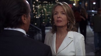 Movie still from “Something's Gotta Give” (2003), directed by Nancy Meyers – A woman in a white suit talking to a man in a black suit; Close Up shot, Over the shoulder angle