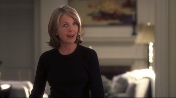 Movie still from “Something's Gotta Give” (2003), directed by Nancy Meyers – A woman in a black shirt is looking at the camera; Medium shot, Over the shoulder angle