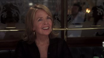 Movie still from “Something's Gotta Give” (2003), directed by Nancy Meyers – A person sitting at a table; Close Up shot, Over the shoulder angle