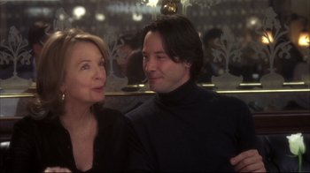 Movie still from “Something's Gotta Give” (2003), directed by Nancy Meyers – A man and a woman standing next to each other; Close Up shot, Over the shoulder angle
