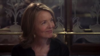 Movie still from “Something's Gotta Give” (2003), directed by Nancy Meyers – A person sitting in front of a window; Close Up shot, Over the shoulder angle