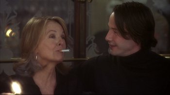 Movie still from “Something's Gotta Give” (2003), directed by Nancy Meyers – A man and a woman are smoking a cigarette together; Close Up shot, Over the shoulder angle
