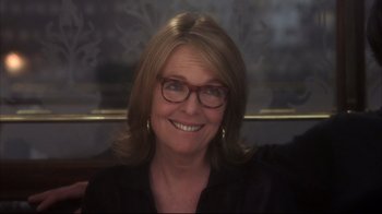 Movie still from “Something's Gotta Give” (2003), directed by Nancy Meyers – A person wearing glasses; Close Up shot, Over the shoulder angle