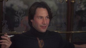 Movie still from “Something's Gotta Give” (2003), directed by Nancy Meyers – A man with long hair wearing a black sweater; Close Up shot, Over the shoulder angle