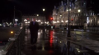 Movie still from “Something's Gotta Give” (2003), directed by Nancy Meyers – A man walking down a wet sidewalk at night; Wide shot, Low angle