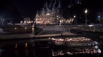 Movie still from “Something's Gotta Give” (2003), directed by Nancy Meyers – A boat on a river near a bridge at night time; Extreme Wide shot, High angle