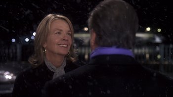 Movie still from “Something's Gotta Give” (2003), directed by Nancy Meyers – A woman smiles at a man in a suit; Close Up shot, Over the shoulder angle