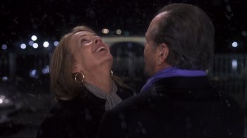 Movie still from “Something's Gotta Give” (2003), directed by Nancy Meyers – A man and a woman are smiling at each other; Close Up shot, Over the shoulder angle