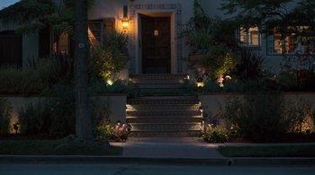 Movie still from “Somewhere” (2010), directed by Sofia Coppola – A night view of the front steps of a house; Extreme Wide shot, High angle