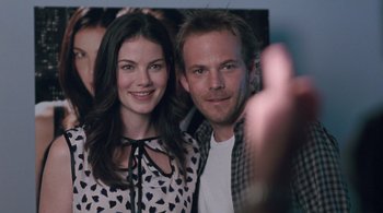 Movie still from “Somewhere” (2010), directed by Sofia Coppola – A man and a woman posing for a picture; Close Up shot, Over the shoulder angle