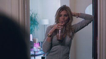Movie still from “Somewhere” (2010), directed by Sofia Coppola – A woman drinking a smoothie in front of a mirror; Medium shot, Over the shoulder angle