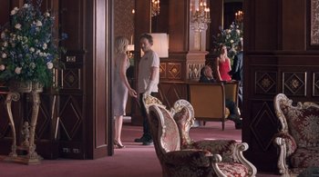 Movie still from “Somewhere” (2010), directed by Sofia Coppola – A man and a woman are standing in a room; Wide shot, Over the shoulder angle