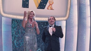 Movie still from “Somewhere” (2010), directed by Sofia Coppola – A man and a woman standing next to each other holding microphones; Wide shot, Low angle