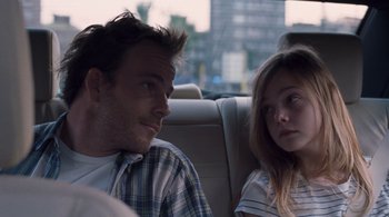 Movie still from “Somewhere” (2010), directed by Sofia Coppola – A man and a woman sitting in a car; Close Up shot, Over the shoulder angle