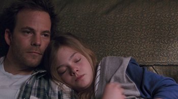 Movie still from “Somewhere” (2010), directed by Sofia Coppola – A man and a little girl sleeping on a couch; Close Up shot, Overhead angle