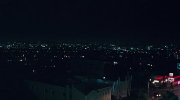 Movie still from “Somewhere” (2010), directed by Sofia Coppola – A view of a city at night from a high point; Extreme Wide shot, High angle