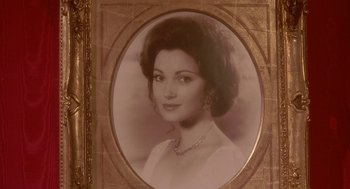 Movie still from “Somewhere in Time” (1980), directed by Jeannot Szwarc – An old photo of a woman in a white dress; Close Up shot, High angle