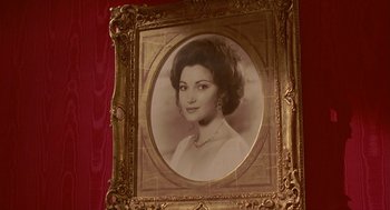 Movie still from “Somewhere in Time” (1980), directed by Jeannot Szwarc – An old photo of a woman in a gold frame; Close Up shot, Low angle