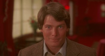 Movie still from “Somewhere in Time” (1980), directed by Jeannot Szwarc – A person wearing a suit and tie; Close Up shot, Over the shoulder angle