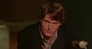 Movie still from “Somewhere in Time” (1980), directed by Jeannot Szwarc – A person wearing a jacket; Close Up shot, Over the shoulder angle