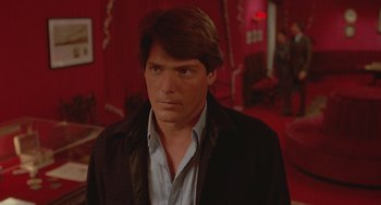 Movie still from “Somewhere in Time” (1980), directed by Jeannot Szwarc – A person wearing a suit and tie; Medium shot, Over the shoulder angle