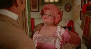 Movie still from “Somewhere in Time” (1980), directed by Jeannot Szwarc – A woman with pink hair and a pink wig; Close Up shot, Over the shoulder angle