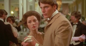 Movie still from “Somewhere in Time” (1980), directed by Jeannot Szwarc – A man and a woman pose for a picture; Close Up shot, Low angle