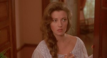 Movie still from “Somewhere in Time” (1980), directed by Jeannot Szwarc – A beautiful woman with long brown hair wearing a white dress; Close Up shot, Over the shoulder angle