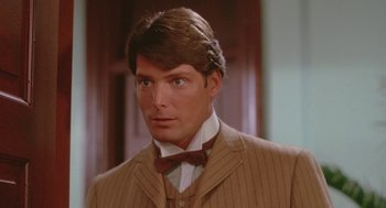 Movie still from “Somewhere in Time” (1980), directed by Jeannot Szwarc – A person wearing a suit and bow tie; Close Up shot, Over the shoulder angle