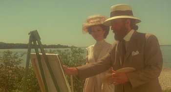 Movie still from “Somewhere in Time” (1980), directed by Jeannot Szwarc – A man and a woman painting a picture on canvas; Medium shot, Over the shoulder angle