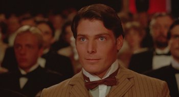 Movie still from “Somewhere in Time” (1980), directed by Jeannot Szwarc – A man in a suit and bow tie; Close Up shot, Over the shoulder angle