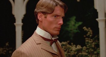 Movie still from “Somewhere in Time” (1980), directed by Jeannot Szwarc – A person wearing a suit and tie; Close Up shot, Over the shoulder angle