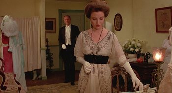 Movie still from “Somewhere in Time” (1980), directed by Jeannot Szwarc – A man and a woman dressed in formal wear; Medium shot, Over the shoulder angle