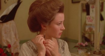 Movie still from “Somewhere in Time” (1980), directed by Jeannot Szwarc – A beautiful woman with long brown hair wearing a white dress; Close Up shot, Over the shoulder angle