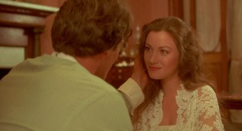 Movie still from “Somewhere in Time” (1980), directed by Jeannot Szwarc – A man touching the ear of a beautiful woman; Close Up shot, Over the shoulder angle
