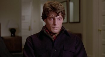 Movie still from “Somewhere in Time” (1980), directed by Jeannot Szwarc – A person wearing a jacket; Close Up shot, Over the shoulder angle