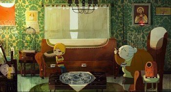Movie still from “Song of the Sea” (2014), directed by Tomm Moore – Two people are sitting on a couch in a living room; Wide shot, Overhead angle