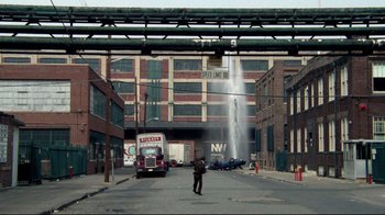 Movie still from “Sorcerer” (1977), directed by William Friedkin – A fire hydrant spewing water onto a city street; Extreme Wide shot, High angle