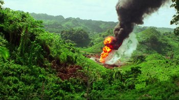Movie still from “Sorcerer” (1977), directed by William Friedkin – An image of an explosion in the middle of the jungle; Extreme Wide shot, High angle