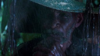 Movie still from “Sorcerer” (1977), directed by William Friedkin – A person wearing a hat; Extreme Close Up shot, High angle