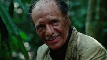Movie still from “Sorcerer” (1977), directed by William Friedkin – An older man with a mustache and a beard; Close Up shot, Low angle
