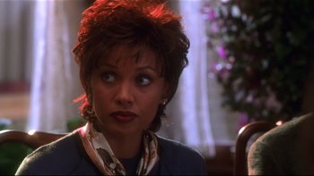 Movie still from “Soul Food” (1997), directed by George Tillman Jr. – A person wearing a scarf; Close Up shot, Over the shoulder angle